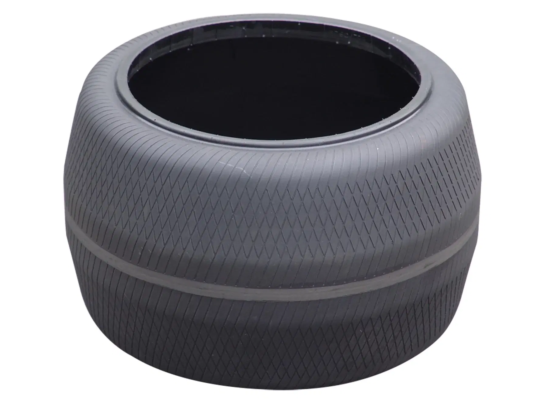 Unidentified upright tire curing bladder with diamond-pattern surface grooves