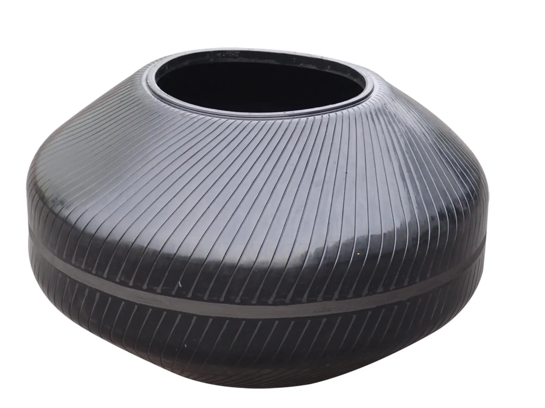 Unidentified wide-profile tire curing bladder with diagonal etched grooves